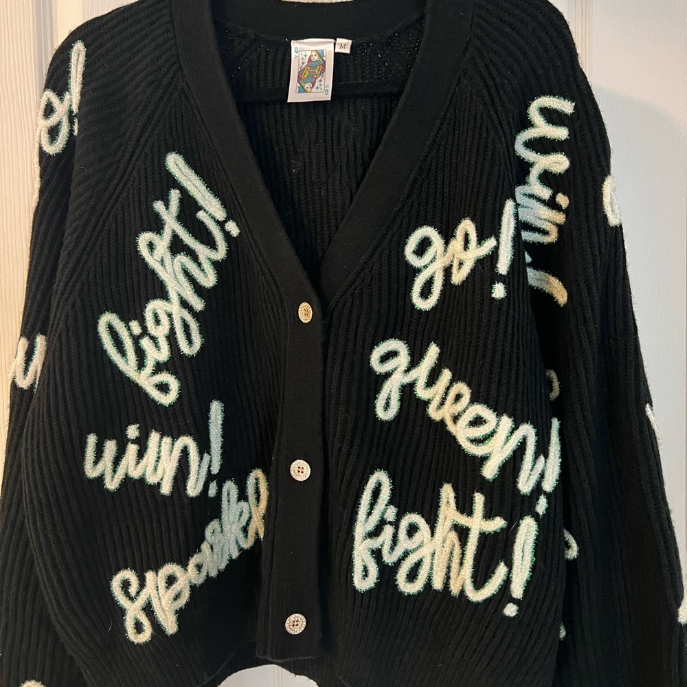 QUEEN OF SPARKLES Black Cardigan with White and Green Accents